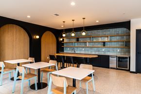 West Allis apartment for rent - A modern dining area with tables and chairs.