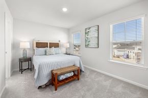 Myrtle Beach apartment for rent - A bedroom with a bed, nightstand, and window.