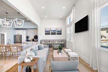 Myrtle Beach apartment for rent - A modern living room with a grey sofa and a wooden coffee table.