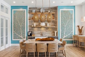 Charleston apartment for rent - a dining room with blue walls and a table with chairs