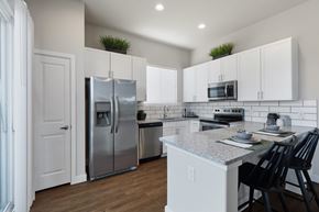 Celina apartment for rent - A kitchen with a refrigerator, microwave, and oven.