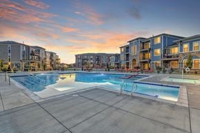Brighton apartment for rent - A large swimming pool surrounded by apartment buildings.