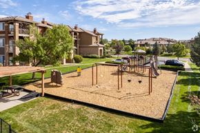 Aurora apartment for rent - a playground in the middle of a park with houses in the background