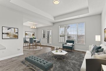 Atlanta apartment for rent - A living room with a grey rug and a white couch.