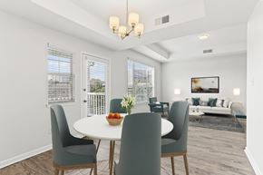Atlanta apartment for rent - a dining room with a table and chairs and a living room