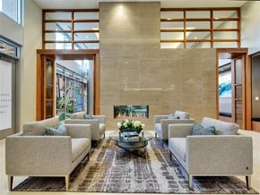 Dallas apartment for rent - a living room with couches and a table and a fireplace