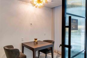 Washington apartment for rent - a conference room with a table and chairs next to a glass door