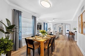 Boca Raton apartment for rent - A dining room with a wooden table and chairs.