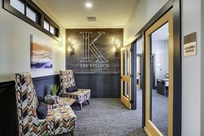 Chelmsford apartment for rent - A waiting area with chairs and a sign that says "The Kinouch".