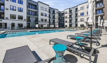 Norwalk apartment for rent - A swimming pool area with sun loungers and a statue.