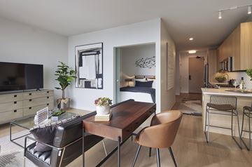 Chicago apartment for rent - A modern living room with a wooden dining table and chairs.