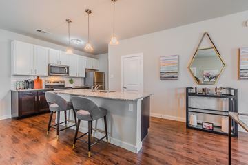 Princeton apartment for rent - A kitchen with a bar and stools.