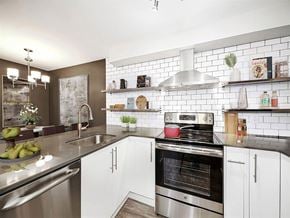 Seattle apartment for rent - Luxury Apartments for Rent in Seattle- Union Bay- Kitchen with Tile Backsplash with Stainless-Steel Appliances and Quartz Countertops