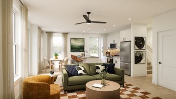 Greer apartment for rent - A modern living room with a green couch and a ceiling fan.