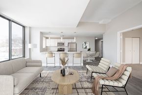 Haverhill apartment for rent - A modern living room with a large window and a dining area in the background.