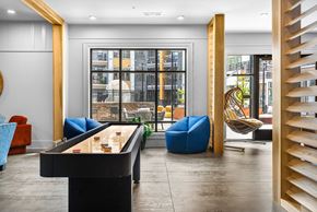 Asheville apartment for rent - A room with a pool table and a chair.