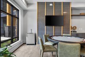 Asheville apartment for rent - A modern dining room with a round table and chairs.