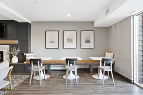 Coon Rapids apartment for rent - a dining room with a table and chairs and a fireplace