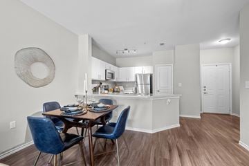 Dallas apartment for rent - A kitchen with a dining table and chairs.