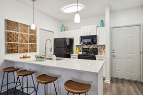 Birmingham apartment for rent - A kitchen with white cabinets and a white counter top.