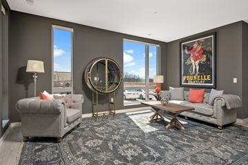 Oak Creek apartment for rent - a living room with couches and chairs and a rug