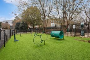 Sandy Springs apartment for rent - A playground with a green slide and a green barrel.