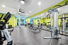 Keller apartment for rent - A gym with a variety of equipment including a leg press machine.
