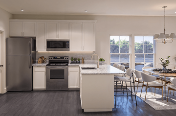 Charleston apartment for rent - A modern kitchen with white cabinets and a large island.