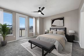 Keller apartment for rent - A bedroom with a large bed and a ceiling fan.