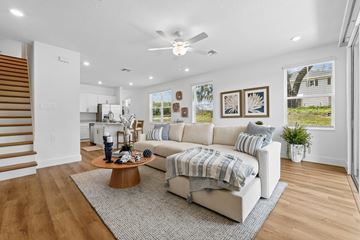 Gainesville apartment for rent - A living room with a white couch and a coffee table.