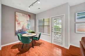 Mckinney apartment for rent - a dining room with a table and chairs and a window