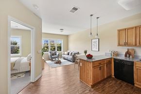 Independence apartment for rent - A kitchen with wooden cabinets and a black dishwasher.