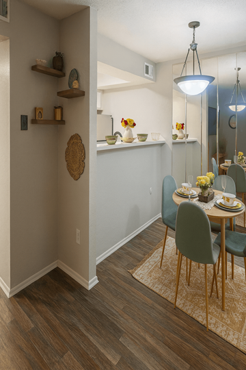 Longview apartment for rent - A dining room with a table set for two and a rug on the floor.