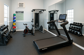 Longview apartment for rent - A gym with a treadmill, weights and exercise bikes.