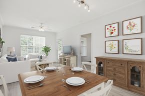 Knightdale apartment for rent - A dining room with a wooden table set for two.