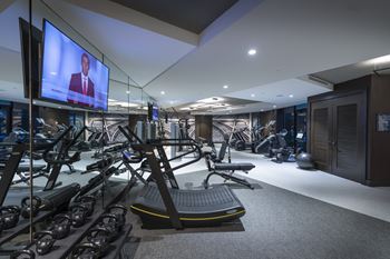 On-site 24-hour fitness center with tablet-integrated cardio machines