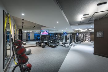 On-site 24-hour fitness center with tablet-integrated cardio machines