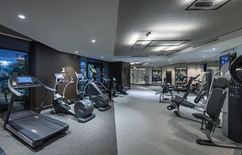 On-site 24-hour fitness center with tablet-integrated cardio machines
