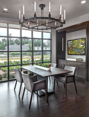 Houston apartment for rent - A modern dining room with a large table and chairs.