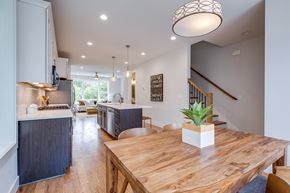 Nashville townhouse for rent - A kitchen with a wooden table and a plant on it.