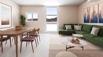 Port Ewen apartment for rent - A living room with a green couch and a wooden table.