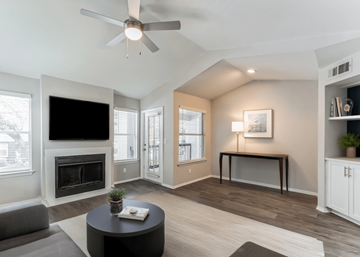 Orlando apartment for rent - A living room with a fireplace and a television.