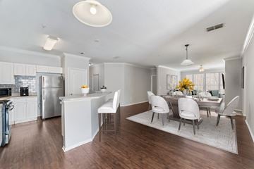 Orlando apartment for rent - A modern kitchen with a dining table set for four.