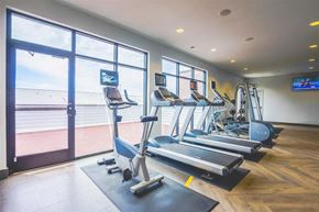 Baltimore apartment for rent - A gym with treadmills and elliptical machines.