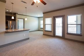 Alpharetta apartment for rent - a living room and a kitchen with a counter top