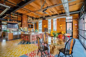Minneapolis apartment for rent - the kitchen and dining area of a loft with a table and chairs