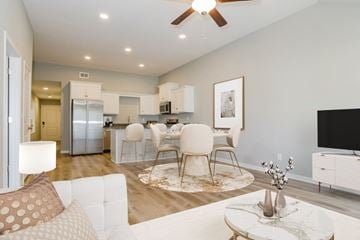 Belton apartment for rent - A modern living room with a white sofa and a coffee table.