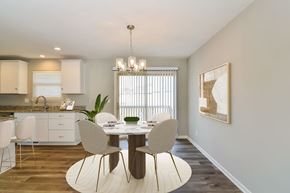 Belton apartment for rent - a dining area with a table and chairs and a kitchen in the background