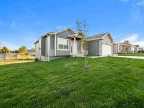 Pleasant Hill apartment for rent - Pleasant Hill, MO Apartments - Tall Grass - Outside View Of Property With Front Lawn Filled With Lots Of Grass And Plants Next To Driveway