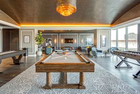 Chicago apartment for rent - a billiards room with a pool table in the middle